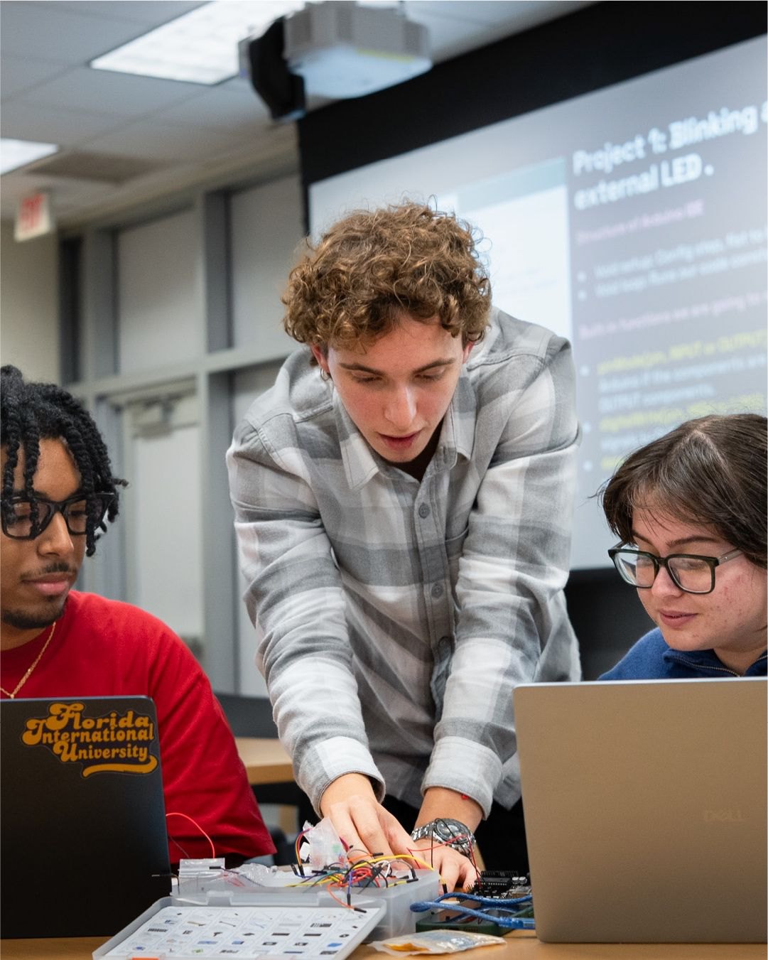 Franco Silvestri teaching a hands-on robotics and electronics workshop at INIT FIU